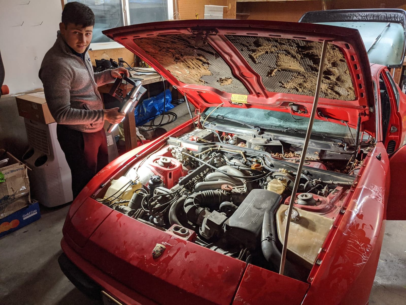 Sorting out the red car's ignition in the garage