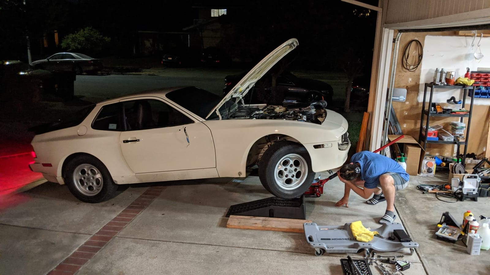 Late-night work session on the 944's undercarriage.
